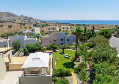 an aerial view of a villa with a resort at Calypso Lindia Luxury Villa in Líndos