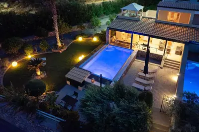 an overhead view of a house with a swimming pool at Calypso Lindia Luxury Villa in Líndos
