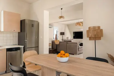 a kitchen and dining room with a table with oranges on it at Calypso Lindia Luxury Villa in Líndos
