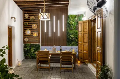 a dining room with a table and chairs at White Memories boutique home - Romantic Stay in Rhodes in Afantou