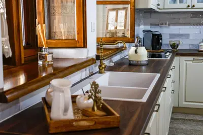 a kitchen with a sink and a counter top at White Memories boutique home - Romantic Stay in Rhodes in Afantou