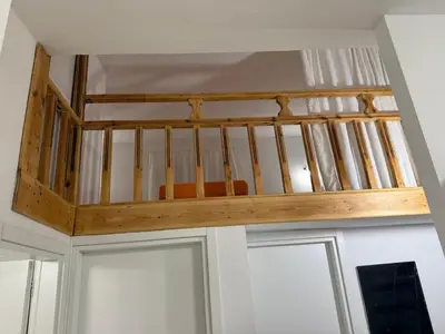 a wooden staircase in a room with two doors at Radiki in Gennadi
