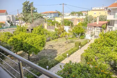 a view of a city from a balcony at ELMA apartment 2 Kremasti in Kremasti