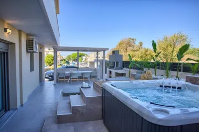 a jacuzzi tub on the balcony of a house at Casa De Sario in Rhodes Town