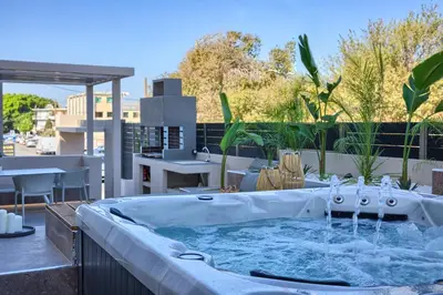 a hot tub sitting on top of a roof at Casa De Sario in Rhodes Town