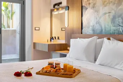 a tray of food on a bed in a hotel room at Casa De Sario in Rhodes Town