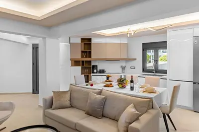 a living room and kitchen with a couch and a table at Casa De Sario in Rhodes Town