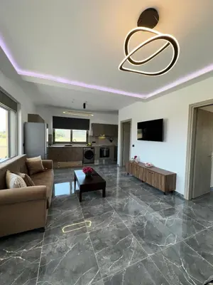 a living room with a couch and a table at Villa Mike in Rhodes Town