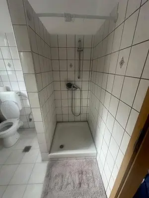 a bathroom with a shower with a toilet at Κakle Kolympia Apartments in Kolimbia
