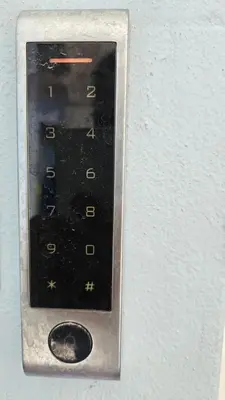 a close up of a remote control on a wall at OASIS Central 007 in Rhodes Town