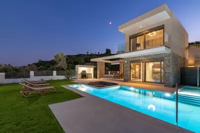 a house with a swimming pool in front of it at Rodos Stars Stellar Villas in Rhodes Town