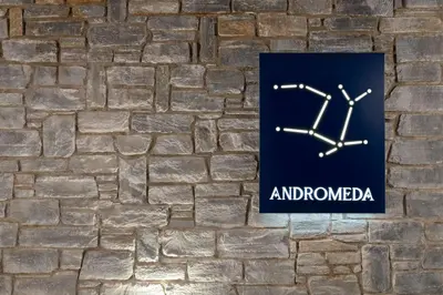 a sign on a brick wall that reads andlando at Rodos Stars Stellar Villas in Rhodes Town