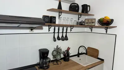 a kitchen with a sink and a counter with utensils at Val & Rin Luxury Apartment in Rhodes Town