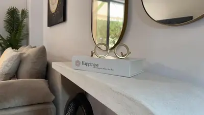two rings on a table in a room with a mirror at Val & Rin Luxury Apartment in Rhodes Town