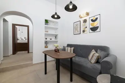 a living room with a couch and a table at Icarus Residence in Rhodes Town