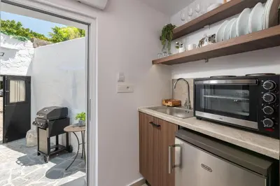 a kitchen with a microwave and a counter top at Icarus Residence in Rhodes Town