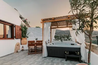 a bathroom with a tub and a table at Lindos Zen luxury villa in Líndos