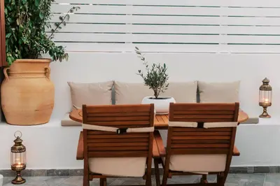 a dining room with a table and two chairs at Lindos Zen luxury villa in Líndos