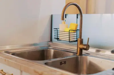 a stainless steel kitchen sink with a faucet at Lindos Zen luxury villa in Líndos