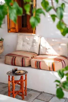 a couch with a table in front of it at Villa Vasoula Lindos, Jasmine and Gardenia Suite in Líndos