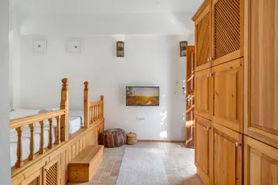 a hallway with a staircase and a stair case at Villa Vasoula Lindos, Jasmine and Gardenia Suite in Líndos