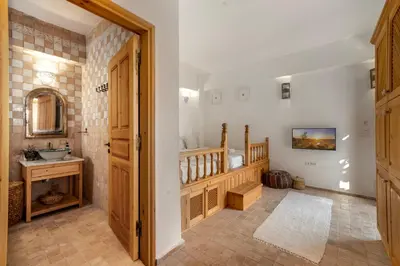 a bathroom with a staircase and a sink in a room at Villa Vasoula Lindos, Jasmine and Gardenia Suite in Líndos