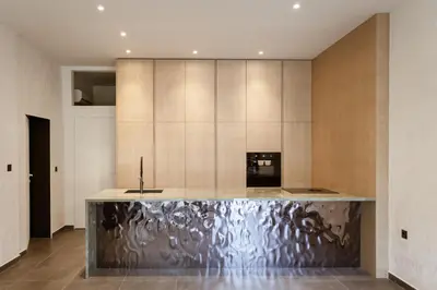 a kitchen with a stainless steel counter top at HUGme Suite in Kalithies