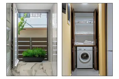 a laundry room with a washing machine and a window at Magical House in Ialyssos