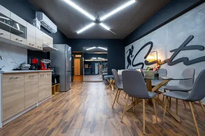 a kitchen and dining room with a table and chairs at House of Paralympic Athlete Mike Seitis in Rhodes Town
