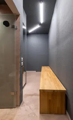 a wooden table in a room with a wall at House of Paralympic Athlete Mike Seitis in Rhodes Town