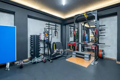 a room with a gym with weights and equipment at House of Paralympic Athlete Mike Seitis in Rhodes Town