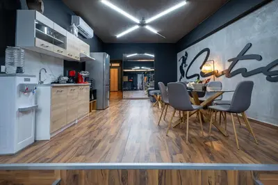 a kitchen and dining room with a table and chairs at House of Paralympic Athlete Mike Seitis in Rhodes Town