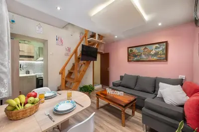 a living room with a couch and a table at Casa Baboulas Old Town in Rhodes Town