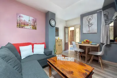 a living room with a couch and a table at Casa Baboulas Old Town in Rhodes Town