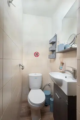 a bathroom with a toilet and a sink at Casa Baboulas Old Town in Rhodes Town