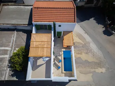 an overhead view of a house with an orange roof at Villa Emerald in Koskinou