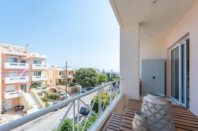 a balcony with a view of a city at Irem's sunrise suite! in Rhodes Town