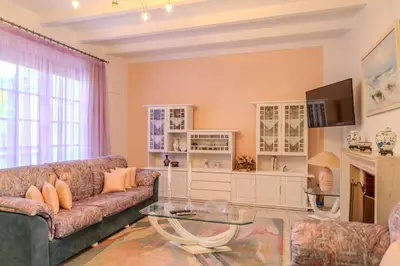 a living room with a couch and a table at Makiaris Villa in Archangelos