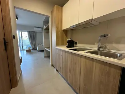 a kitchen with a sink and a counter top at Marev Nature & Luxury Suites -Private Jacuzzi in Ialyssos