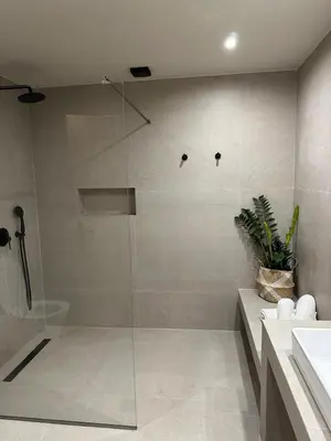 a glass shower in a bathroom with a sink at Marev Nature & Luxury Suites -Private Jacuzzi in Ialyssos