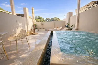 a swimming pool on the patio of a house at Marev Nature & Luxury Suites -Private Jacuzzi in Ialyssos