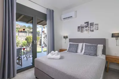 a bedroom with a bed with two towels on it at Villa Mariani in Kalathos