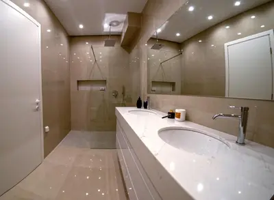 a bathroom with two sinks and a large mirror at Ortus Luxury Residence in Rhodes Town
