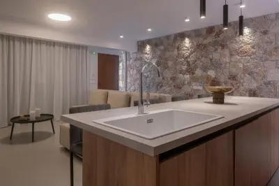 a bathroom with a white sink in a room at Ortus Luxury Residence in Rhodes Town