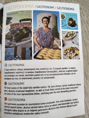 a flyer for a restaurant with pictures of food at The Windmill in Symi