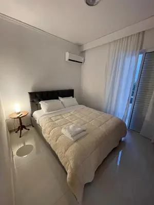 a bedroom with a large bed and a window at Diagoras Suites in Rhodes Town