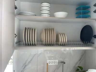 a shelf with plates and bowls on it at Diagoras Suites in Rhodes Town