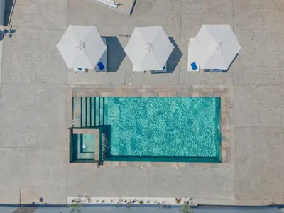 an overhead view of a swimming pool with umbrellas at Casa Del Silencio in Pastida