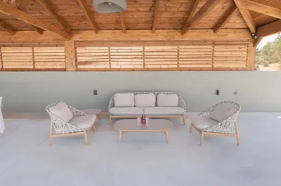 a living room with a couch and two chairs and a table at Casa Del Silencio in Pastida