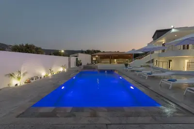 a large swimming pool in front of a house at Casa Del Silencio in Pastida